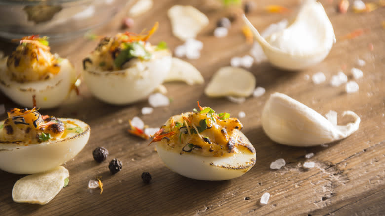 Deviled quail eggs on wooden table