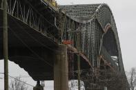 This photo shows the Delaware River Bridge in Bristol, Pa., Monday, Jan. 23, 2017. Tens of thousands of drivers are being told to expect "extreme" delays for weeks because the bridge connecting Pennsylvania and New Jersey had to be shut down over a cracked steel truss. (AP Photo/Matt Rourke)