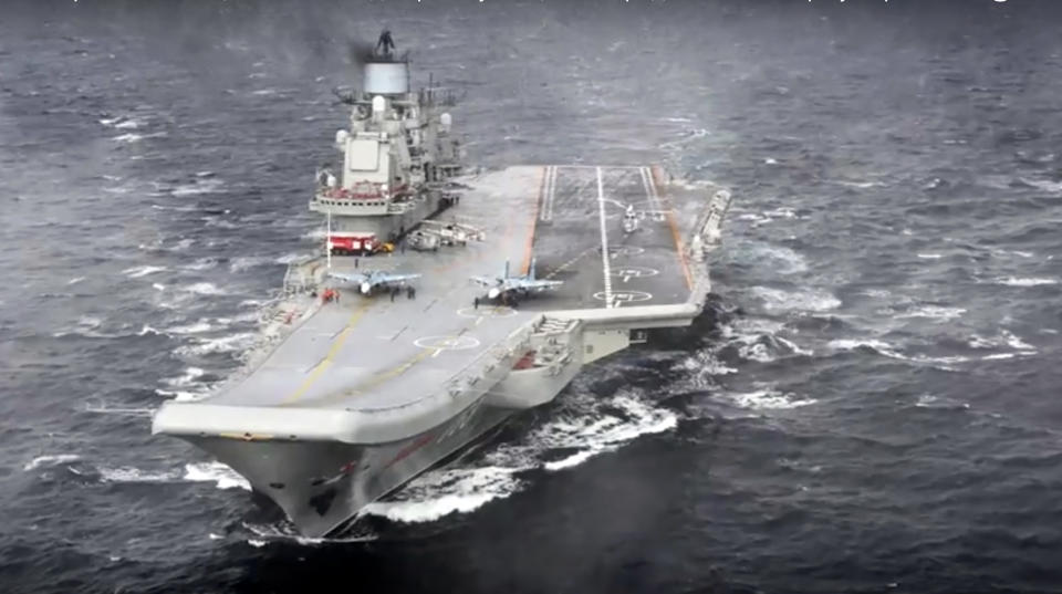 In this photo made from the footage taken from Russian Defense Ministry official web site on Wednesday, Jan. 4, 2017, the Admiral Kuznetsov aircraft carrier is on a mission in the eastern Mediterranean Sea. (Russian Defense Ministry Press Service/ Photo via AP)