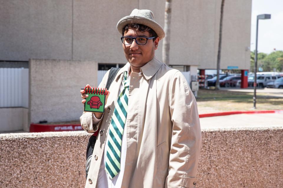 Orlando Talamintes, of San Antonio, dressed as Blues Clues’ Steve, shows off his handy dandy notebook at Corpus Christi Comic Con in the American Bank Center on Friday, July 28, 2023.