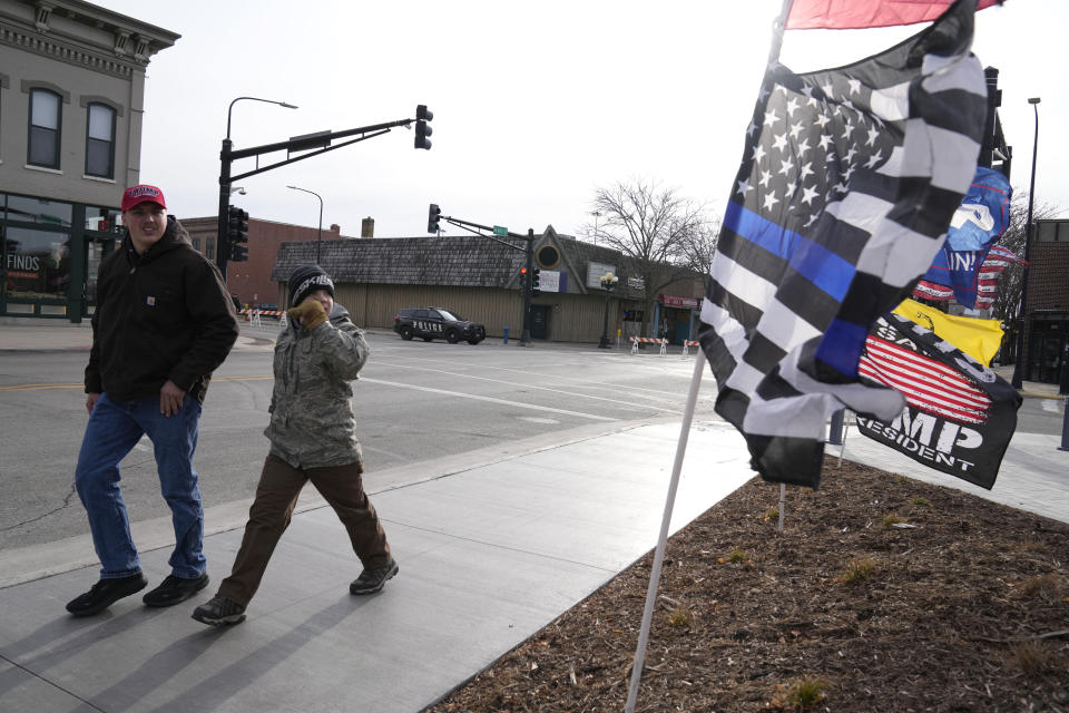 Supporters arrive at a former President Donald Trump commit to caucus rally, Tuesday, Dec. 19, 2023, in Waterloo, Iowa. (AP Photo/Charlie Neibergall)