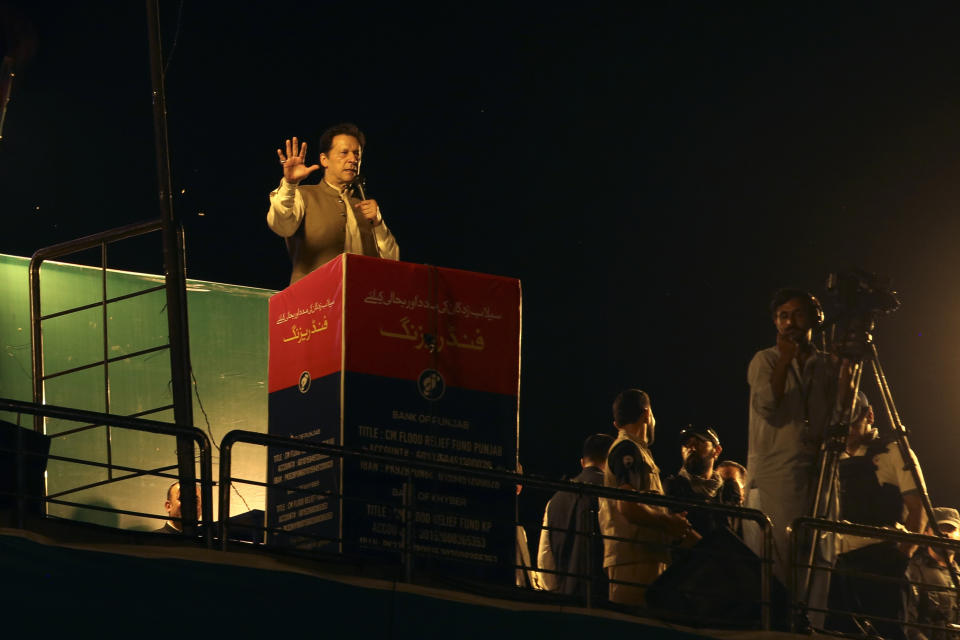 Pakistani opposition leader Imran Khan, center, addresses his party supporters during a rally in Peshawar, Pakistan, Tuesday, Sept. 6, 2022. Since he was toppled by parliament five months ago, former Prime Minister Imran Khan has demonstrated his popularity with rallies that have drawn huge crowds and signaled to his rivals that he remains a considerable political force. (AP Photo/Mohammad Sajjad)