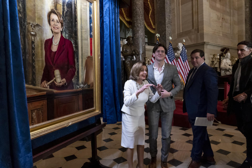 Speaker of the House Nancy Pelosi, D-Calif., is joined by her family as they attend her portrait unveiling ceremony in Statuary Hall at the Capitol in Washington, Wednesday, Dec. 14, 2022. (AP Photo/J. Scott Applewhite)