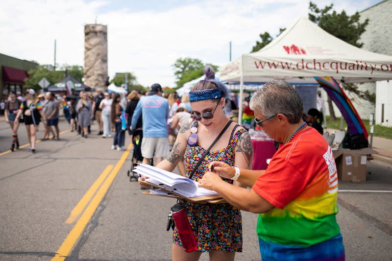 FILE PHOTO: Volunteer gathers signatures for a proposed abortion amendment