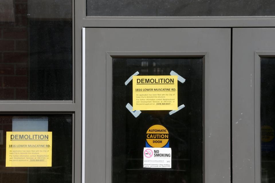 Demolition signs hang on the doorway of the former Kirkwood Community College Iowa City campus Wednesday, March 20, 2024 in Iowa City, Iowa. P&G is planning to knock down the existing structures as they consider a potential future expansion.