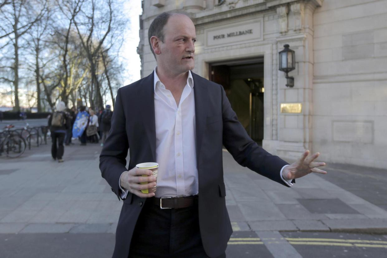 Resignation: MP Douglas Carswell leaves a television studio in central London: REUTERS