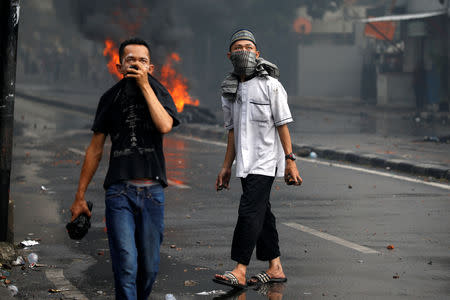 Men take part in a protest following the announcement of last month's election official results in Jakarta, Indonesia, May 22, 2019. REUTERS/Willy Kurniawan