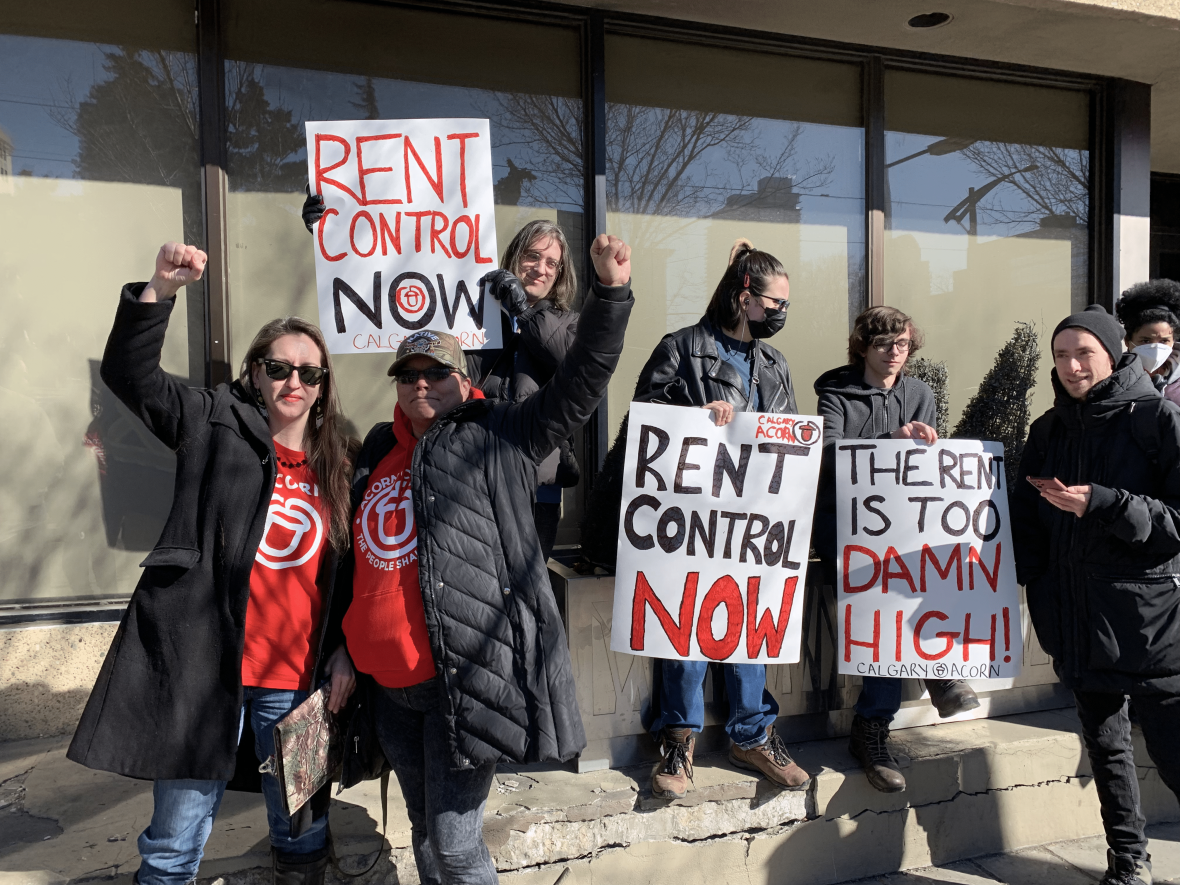 Over a dozen ACORN members protested in downtown Calgary on Wednesday, calling for rent control. (Karina Zapata/CBC - image credit)