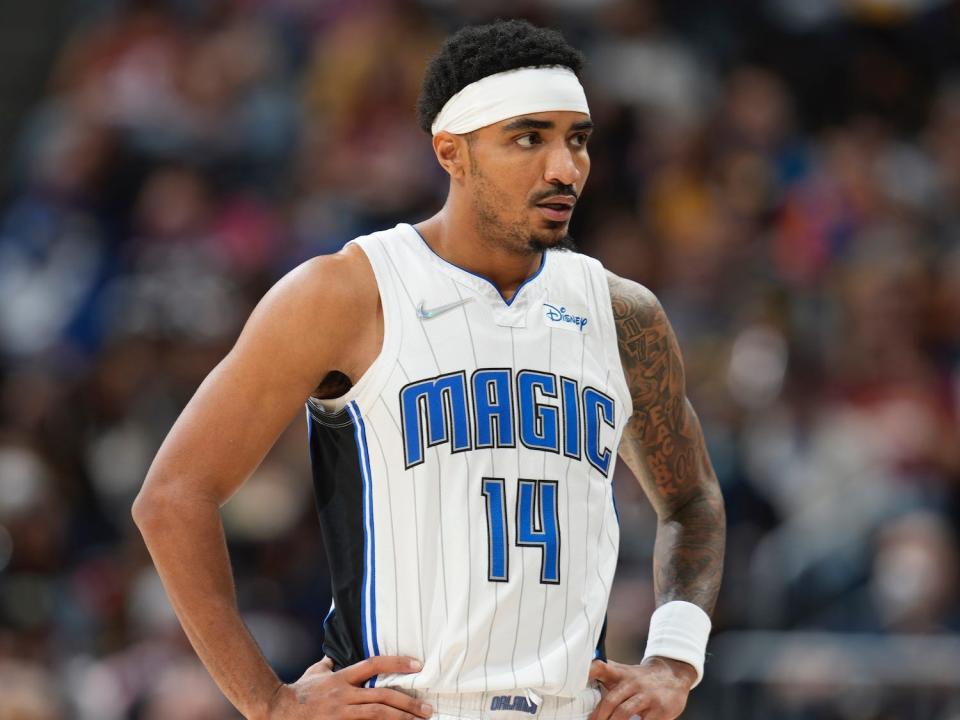 Gary Harris stands with his hands on his hips and looks on during a game.