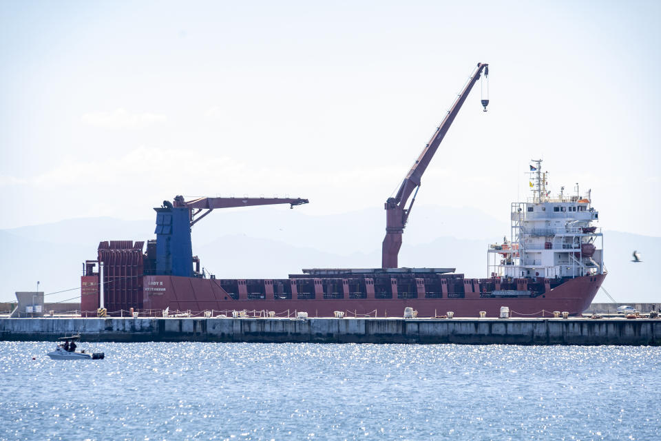 The Russian vessel, Lady R, is docked at the Simon's Town Naval Base near Cape Town, South Africa, Thursday, Dec. 8, 2022. The U.S. ambassador to South Africa has accused the country of providing weapons to Russia. Ambassador Reuben Brigety said the U.S. government was certain that weapons were loaded onto a cargo ship that docked secretly at a naval base near the city of Cape Town for three days in December. (AP Photo)