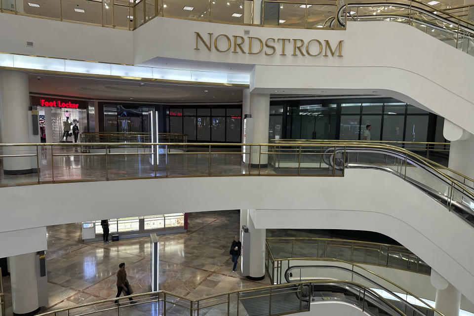 Few shoppers are seen in the upper floors of the Westfield San Francisco Centre shopping mall on June 21, 2023. San Francisco's downtown has seen an exodus of retailers and now a shopping mall owner is turning the complex over to its lender in the face of declining foot traffic and empty office space. While San Francisco faces some of its own unique issues the problems serve as warning signs for other downtowns across the country, which are also feeling some pain. (AP Photo/Eric Risberg)