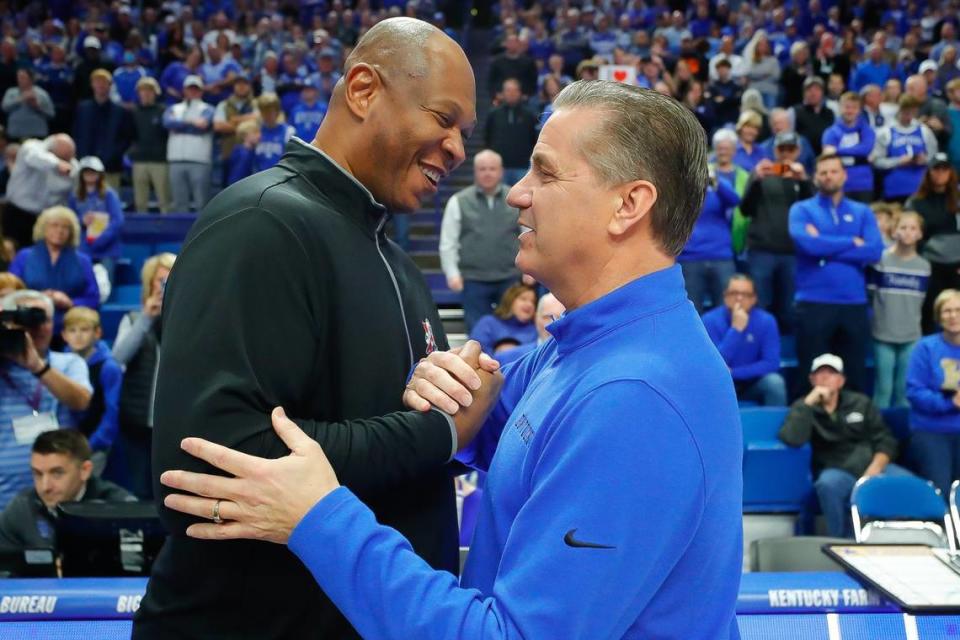 Kentucky Coach John Calipari, right, ran his record vs. Louisville to 12-3 as UK head man with an 86-63 victory over U of L in the first rivalry game for the Cardinals’ Kenny Payne, left, as Cards coach.