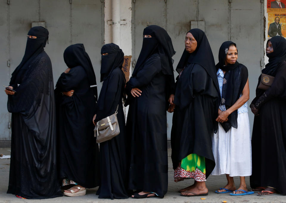 <p>Women queue as they wait for a polling station to open to cast their votes in the presidential election in Mombasa, Kenya, Aug. 8, 2017. (Photo: Siegfried Modola/Reuters) </p>