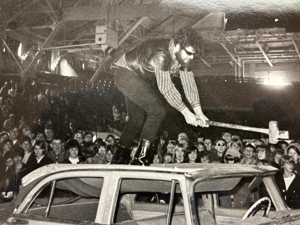 A member of Andy Warhol's entourage smashes the roof of an old DeSoto with a sledgehammer as part of the theatrics at Andy Warhol's 1966 Mod Wedding. The meaning of the DeSoto destruction was left unsaid. The car sported a sticker that read, "If It Moves, Fondle It."