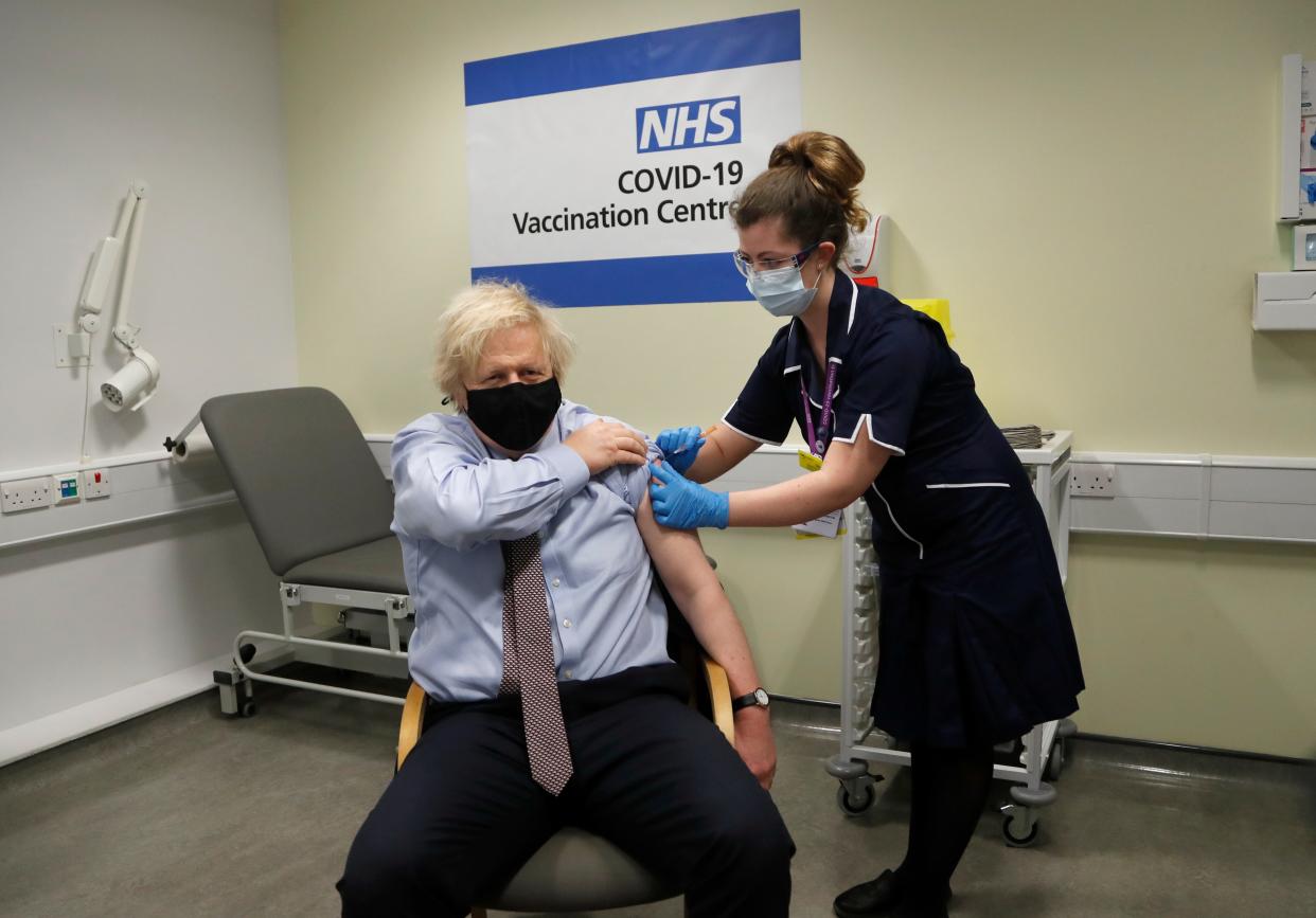 <p>Nurse and clinical pod lead Lily Harrington adninisters the AstraZeneca vaccine to Mr Johnson at St Thomas’ Hospital, London, on Friday</p> (AP)