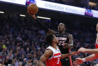 Miami Heat guard Kendrick Nunn goes to the basket against Sacramento Kings guard Yogi Ferrell during the first quarter of an NBA basketball game in Sacramento, Calif., Friday, Feb. 7, 2020. (AP Photo/Rich Pedroncelli)