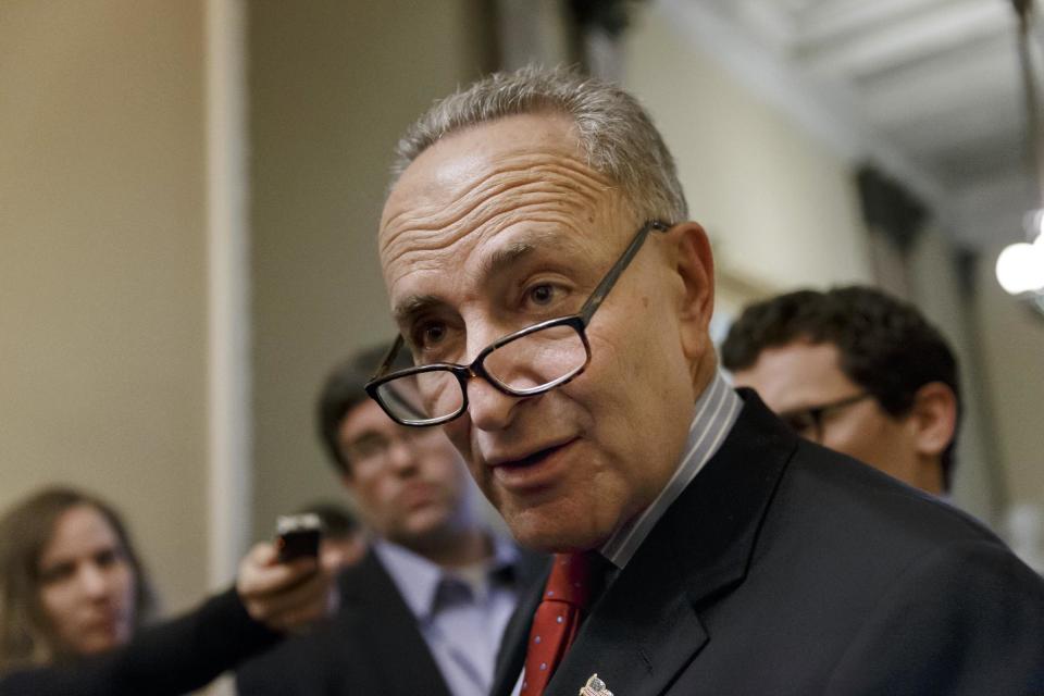 FILE - In this March 26, 2014, file photo, Sen. Charles Schumer, D-N.Y., the Democratic Policy Committee chairman, talks to the media on Capitol Hill in Washington following a news conference on the Senate Democratic agenda. Schumer stood by the World Trade Center on Sunday, March 30, demanding that federal officials review security after daredevils twice sneaked to the top of the site's signature, 104-story skyscraper. (AP Photo/J. Scott Applewhite, File)