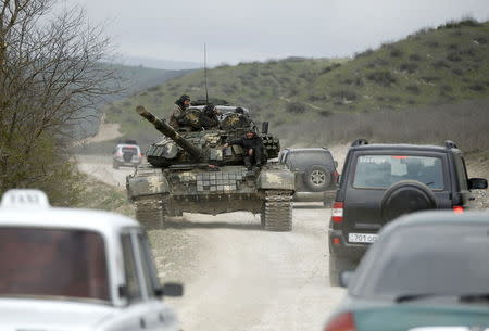 A tank of the self-defense army of Nagorno-Karabakh moves on the road near the village of Mataghis April 6, 2016. REUTERS/Staff