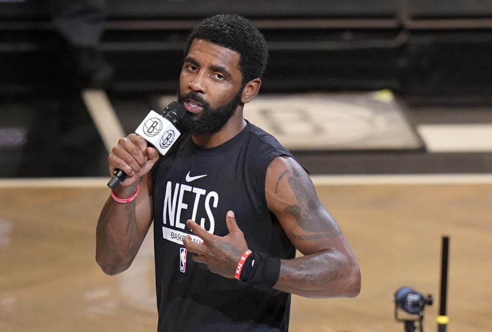 FILE - Brooklyn Nets' Kyrie Irving speaks before the team's NBA basketball game against the New Orleans Pelicans on Oct. 19, 2022, in New York. The Nets are suspending Irving for at least five games without pay, saying they were dismayed by his failure to “unequivocally say he has no antisemitic beliefs.” Hours after Irving refused to issue the apology that NBA Commissioner Adam Silver sought for posting a link to an antisemitic work on his Twitter feed, the Nets said that Irving is “currently unfit to be associated with the Brooklyn Nets.” (AP Photo/Frank Franklin II, File)