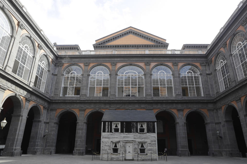 The house of U.S. civil rights campaigner Rosa Parks, rebuilt by artist Ryan Mendoza, is on display in the courtyard of an 18th century Royal Palace, in Naples, Italy, Tuesday, Sept. 15, 2020. It’s the latest stop for the house in a years-long saga that began when Parks’ niece saved the tiny two-story home from demolition in Detroit after the 2008 financial crisis. (AP Photo/Gregorio Borgia)