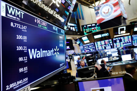 FILE PHOTO: A Walmart logo is displayed above the floor of the New York Stock Exchange shortly after the opening bell in New York, U.S., August 16, 2018. REUTERS/Lucas Jackson/File Photo