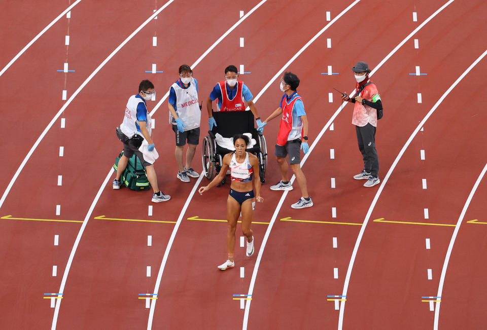 Katarina Johnson-Thompson waves off help and begins to run to the finish line. (Photo by Rob Carr/Getty Images)