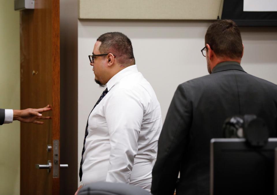 Luis Perez, 27, exits the courtroom after being sentenced to five consecutive life sentences for the 2018 murders of Steven Marler, Aaron "Joshua" Hampton, and Sabrina Starr and assault of two others. 