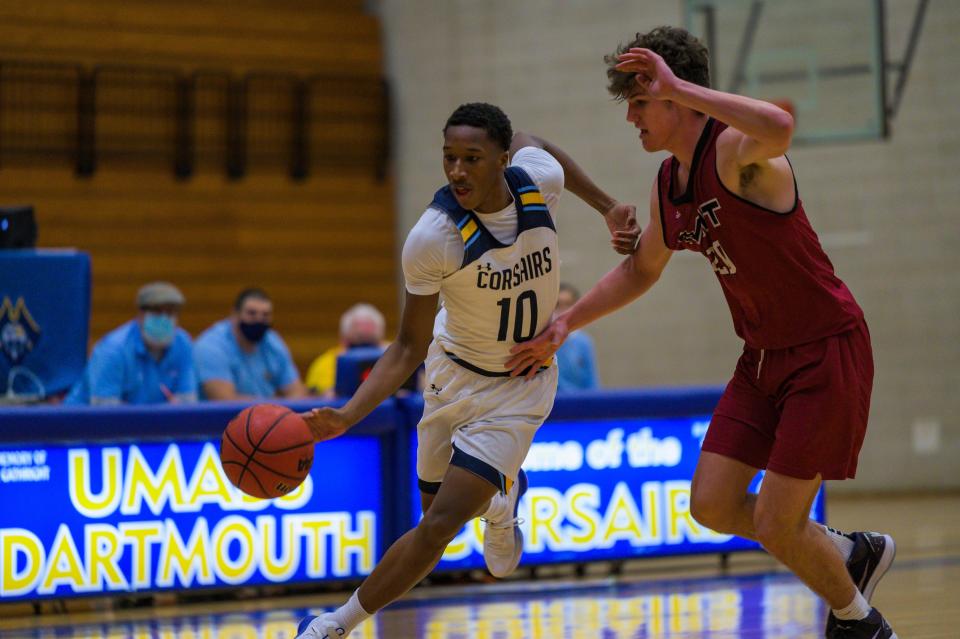 UMass-Dartmouth's Marcus Azor, a Brockton High product,  drives past a defender during a game against MIT earlier this season.