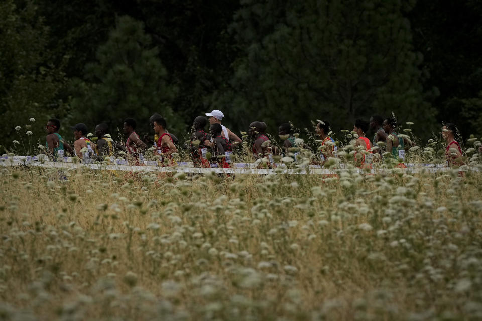 Runners compete during the marathon at the World Athletics Championships Sunday, July 17, 2022, in Eugene, Ore. (AP Photo/Charlie Riedel)