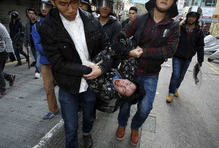 A protester shouts as he is arrested by plainclothes policemen after a clash at Mongkok district in Hong Kong, China February 9, 2016. REUTERS/Liau Chung-ren