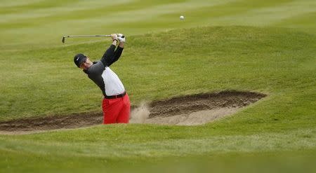 Golf - BMW PGA Championship - Virginia Water, Surrey, England - 22/5/15. Northern Ireland's Rory McIlroy plays his second shot on the 3rd during the second round. REUTERS/Andrew Boyers