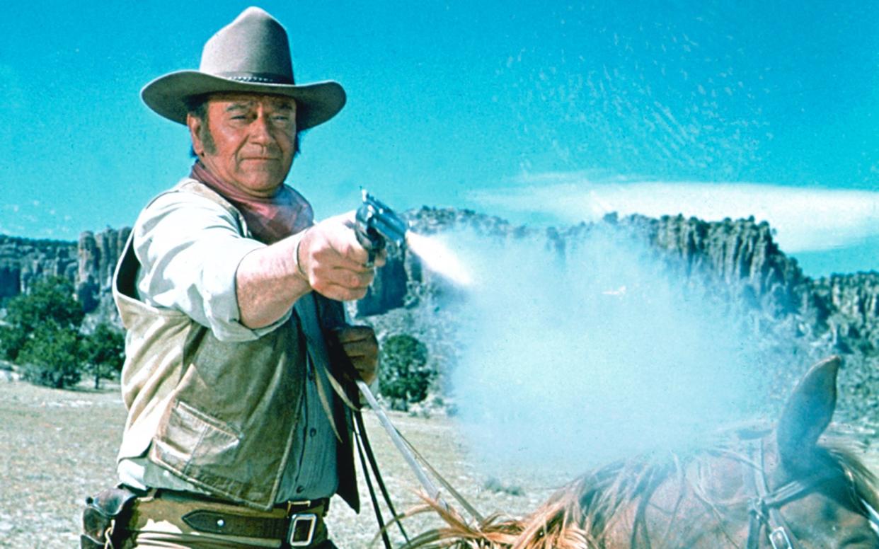 Cocksure: John Wayne stars in The Undefeated (1969) - Getty