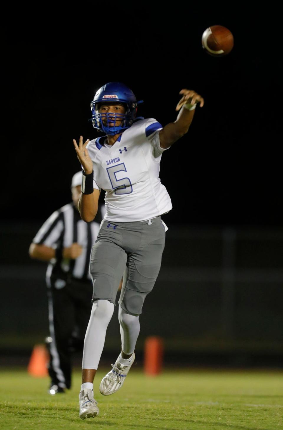 Barron Collier quarterback Brian Williams makes a completion during his game against South Fort Myers. The Barron Collier Cougars visited the South Fort Myers Wolfpack on Friday, Oct. 6, 2023.

Ricardo Rolon/USA TODAY NETWORK-FLORIDA