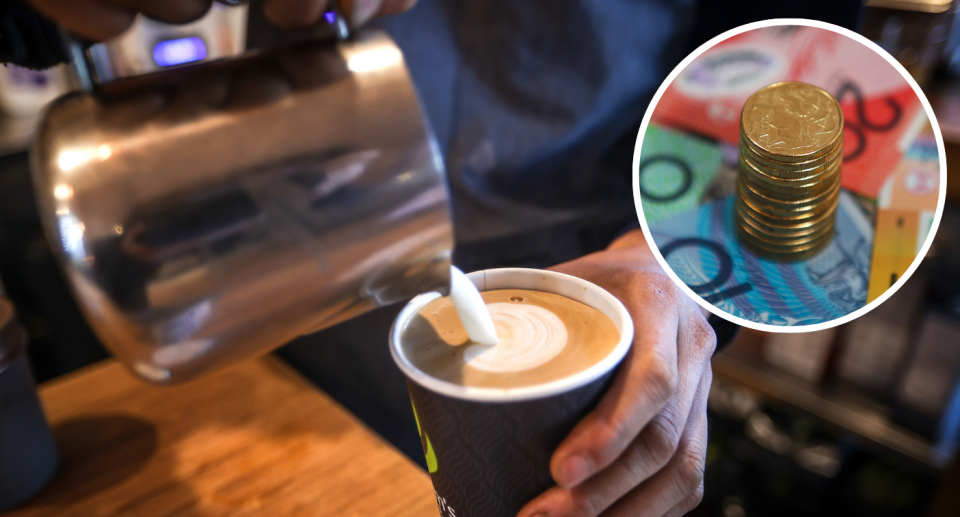 Barista pouring cup of coffee next to Australian $1 coins on top of notes