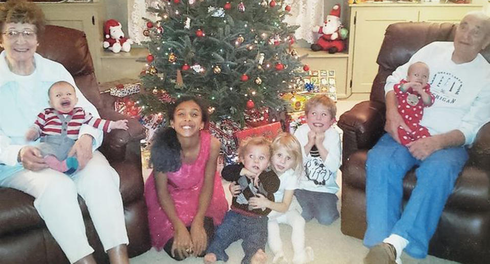 Freda Austin (left) and Les Austin with their grand children and great grandchildren.