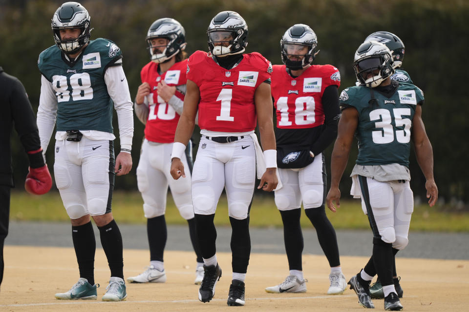 Philadelphia Eagles quarterback Jalen Hurts and teammates prepare to run a drill at the NFL football team's facility in Philadelphia, Thursday, Jan. 12, 2023. (AP Photo/Matt Rourke)