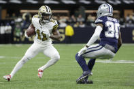 New Orleans Saints wide receiver Deonte Harris (11) runs against Dallas Cowboys cornerback Anthony Brown (30) during the first half of an NFL football game, Thursday, Dec. 2, 2021, in New Orleans. (AP Photo/Derick Hingle)