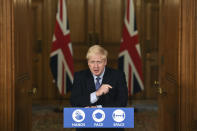 Britain's Prime Minister Boris Johnson speaks, during a coronavirus media briefing in Downing Street, London, Tuesday, Oct. 20, 2020. British Prime Minister Boris Johnson says he is imposing the highest level of coronavirus restrictions on the Greater Manchester region, after days-long negotiations between his government and local leaders who reject the measures broke down with no deal reached. (Leon Neal/Pool Photo via AP)