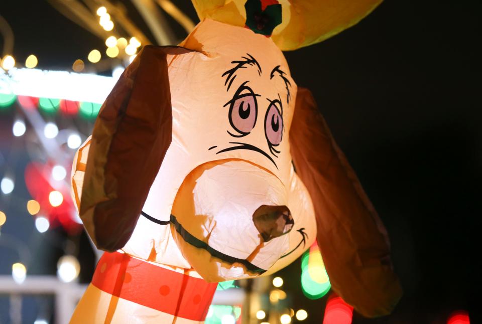 The long-suffering Max is among the decorations dedicated to his master, the Grinch, at the Red Lion Road home of Nino Mallari and Gloria Rivera, just up the road from the 'Christmas House' holiday light display.