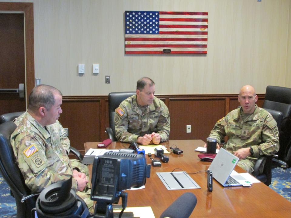 Command Sgt. Maj. Bryan Barker, far right, makes comments during a "state of Fort Liberty" discussion Thursday, Feb. 15, 2024, while Lt. Gen. Christopher Donahue, center, and Command Sgt. Maj. Gregory Seymour, far left, listen.
