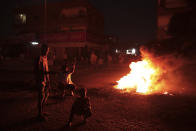 People protest in Khartoum, Sudan, two days after a military coup, Wednesday, Oct. 27, 2021. The coup threatens to halt Sudan's fitful transition to democracy, which began after the 2019 ouster of long-time ruler Omar al-Bashir and his Islamist government in a popular uprising. It came after weeks of mounting tensions between military and civilian leaders over the course and pace of that process. (AP Photo/Marwan Ali)