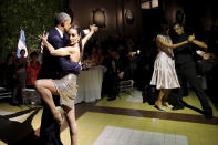 <p>President Barack Obama and his wife Michelle dance tango during a state dinner hosted by Argentina’s President Mauricio Macri at the Centro Cultural Kirchner as part of President Obama’s two-day visit to Argentina, in Buenos Aires March 23, 2016. (Carlos Barria/Reuters) </p>