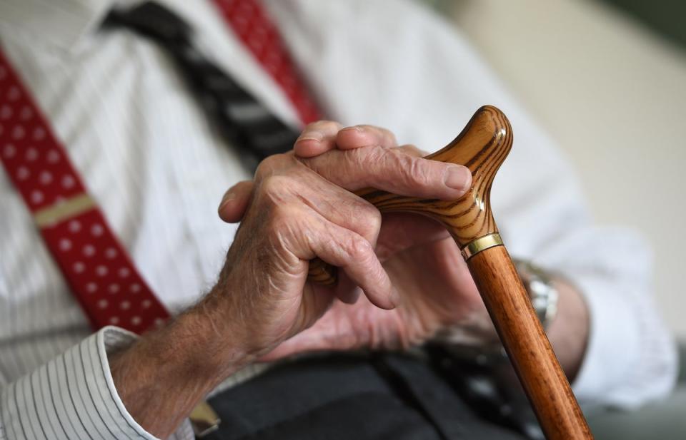 An elderly man holding a walking stick (Joe Giddens/PA) (PA Wire)