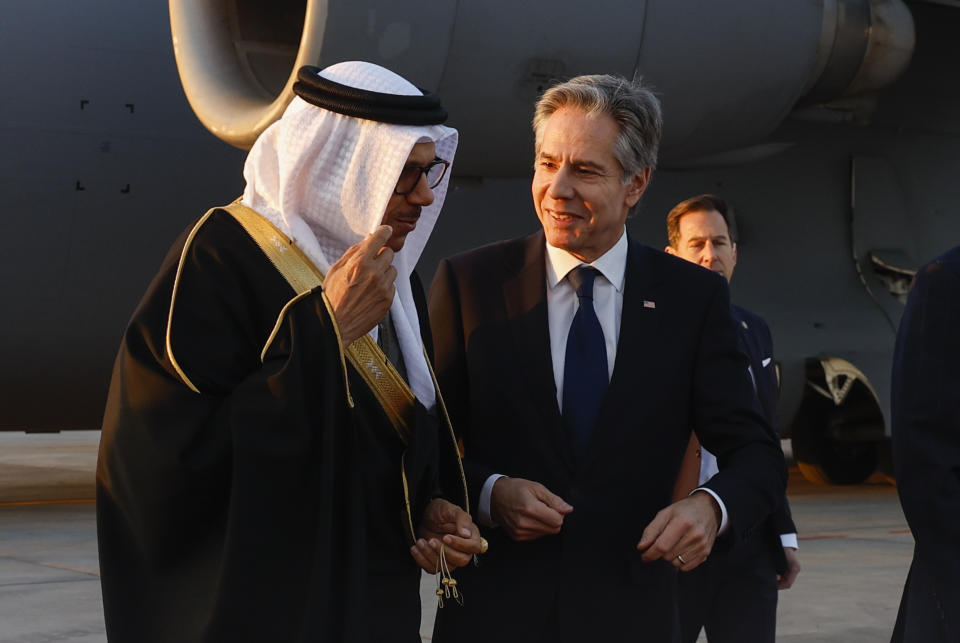 U.S. Secretary of State Antony Blinken, right, walks with Bahrain's Foreign Minister Abdullatif bin Rashid al-Zayani as he arrives in Manama, Bahrain, Wednesday, Jan. 10, 2024. (Evelyn Hockstein/Pool Photo via AP)