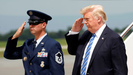 U.S. President Donald Trump returns a salute as he steps from Air Force One, en route to nearby Camp David to meet with the National Security Council to try to agree on a strategy for Afghanistan, in Hagerstown, Maryland, U.S., August 18, 2017. REUTERS/Kevin Lamarque