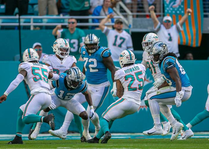 Miami Dolphins cornerback Xavien Howard (25), returns an interception deep into Dolphins territory against the Carolina Panthers during NFL game at Hard Rock Stadium Sunday in Miami Gardens. 