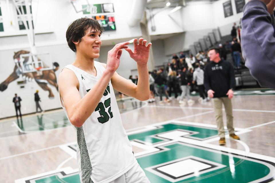 Fossil Ridge's Nick Randall reacts after winning a boys high school basketball playoff game against Chaparral at Fossil Ridge High School on in February 2022.