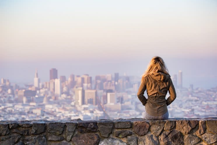 Woman in front of skyline