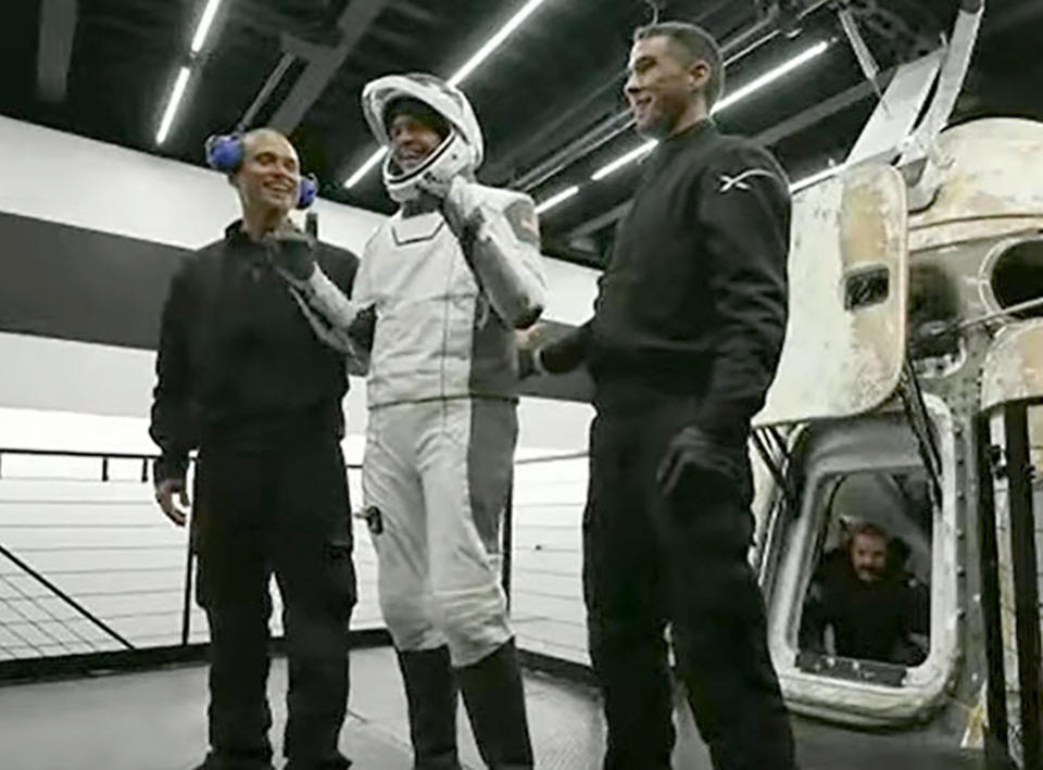 In this image taken from video, Jared Isaacman, one of four passengers aboard the SpaceX capsule, reacts after emerging from the capsule Saturday, Sept. 18, 2021, after it was recovered following its splashdown in the Atlantic off the Florida coast. The all-amateur crew was the first to circle the world without a professional astronaut. (Inspiration4 via AP)