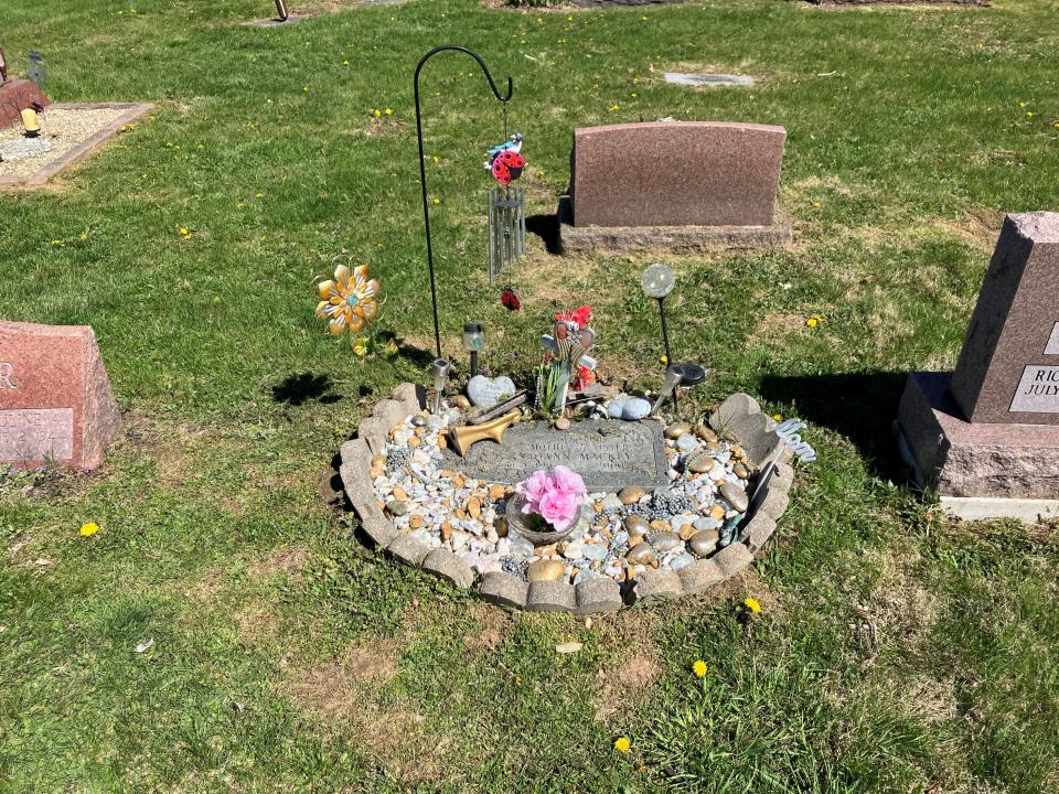 A grave site at Cedar Hill Cemetery in violation of the decoration policy now being reviewed.